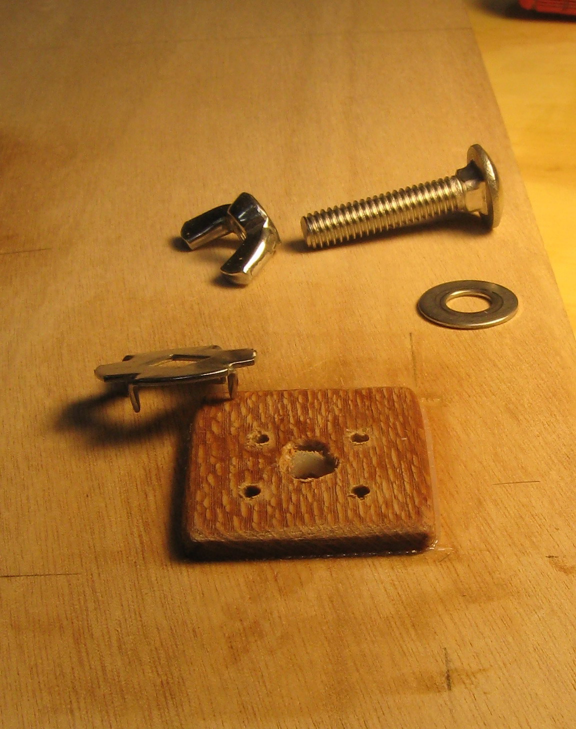 Detail of carriage bolt attachment; collars are stainless from McMaster-Carr.
