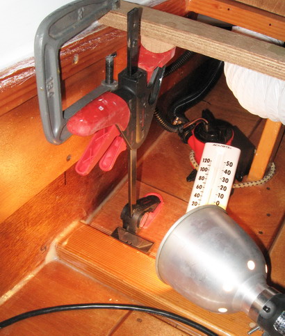 Clamp up, aft location; Thick filled epoxy between mounting ply and hull protects hull from rot.