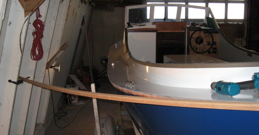 Clamp on wall holds end of aft port sheer guard for correct angle, first screw in.