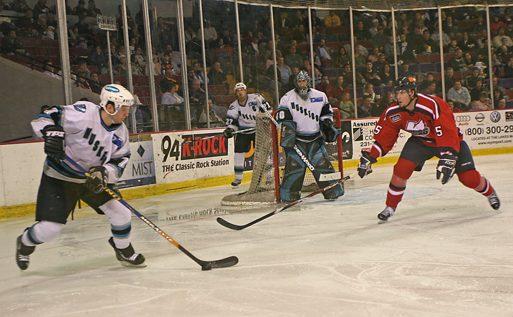 Furiously clearing the puck.