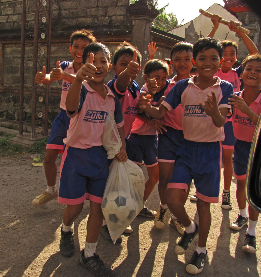 School Kids Carrying their Soccer Balls