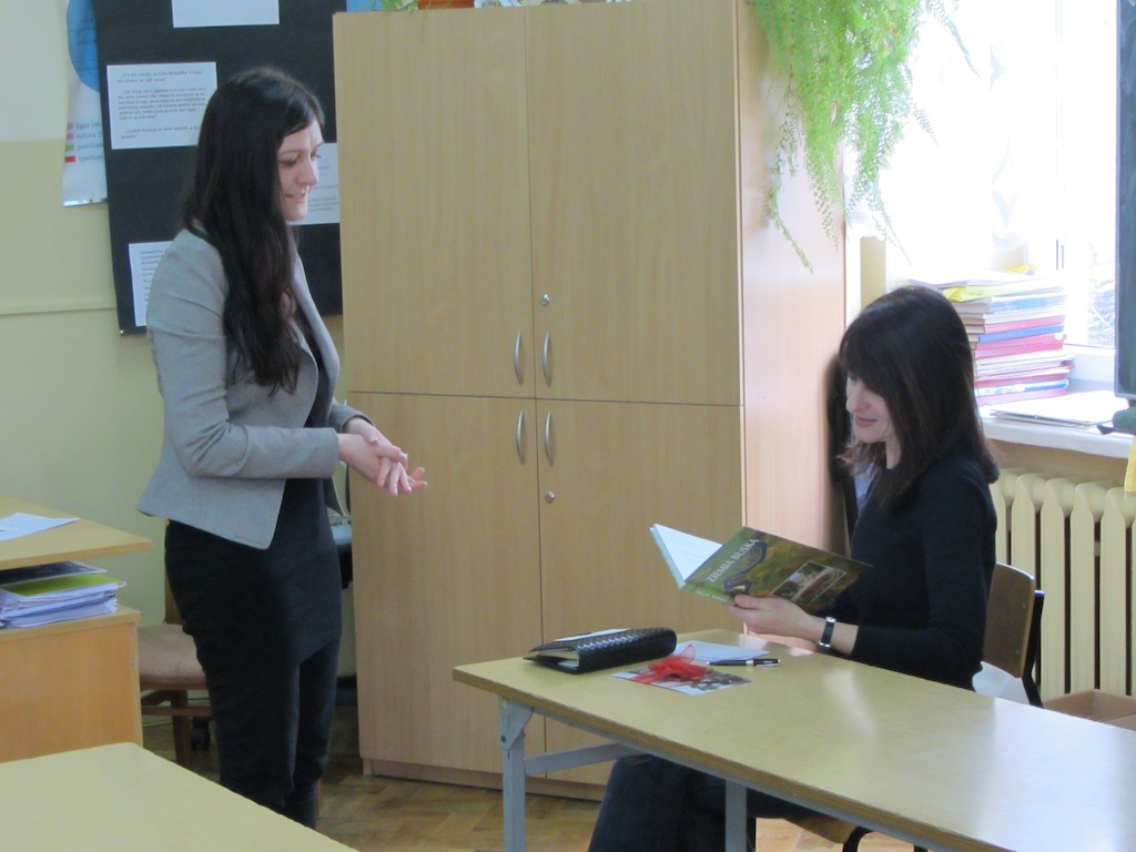 Viewing the gift made by the school and students of a book on Busko-Zdrj and the surrounding communities