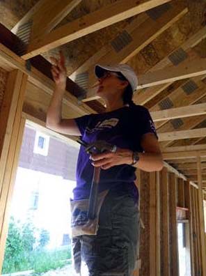 02 Margaret putting up hurricane clamps.jpg