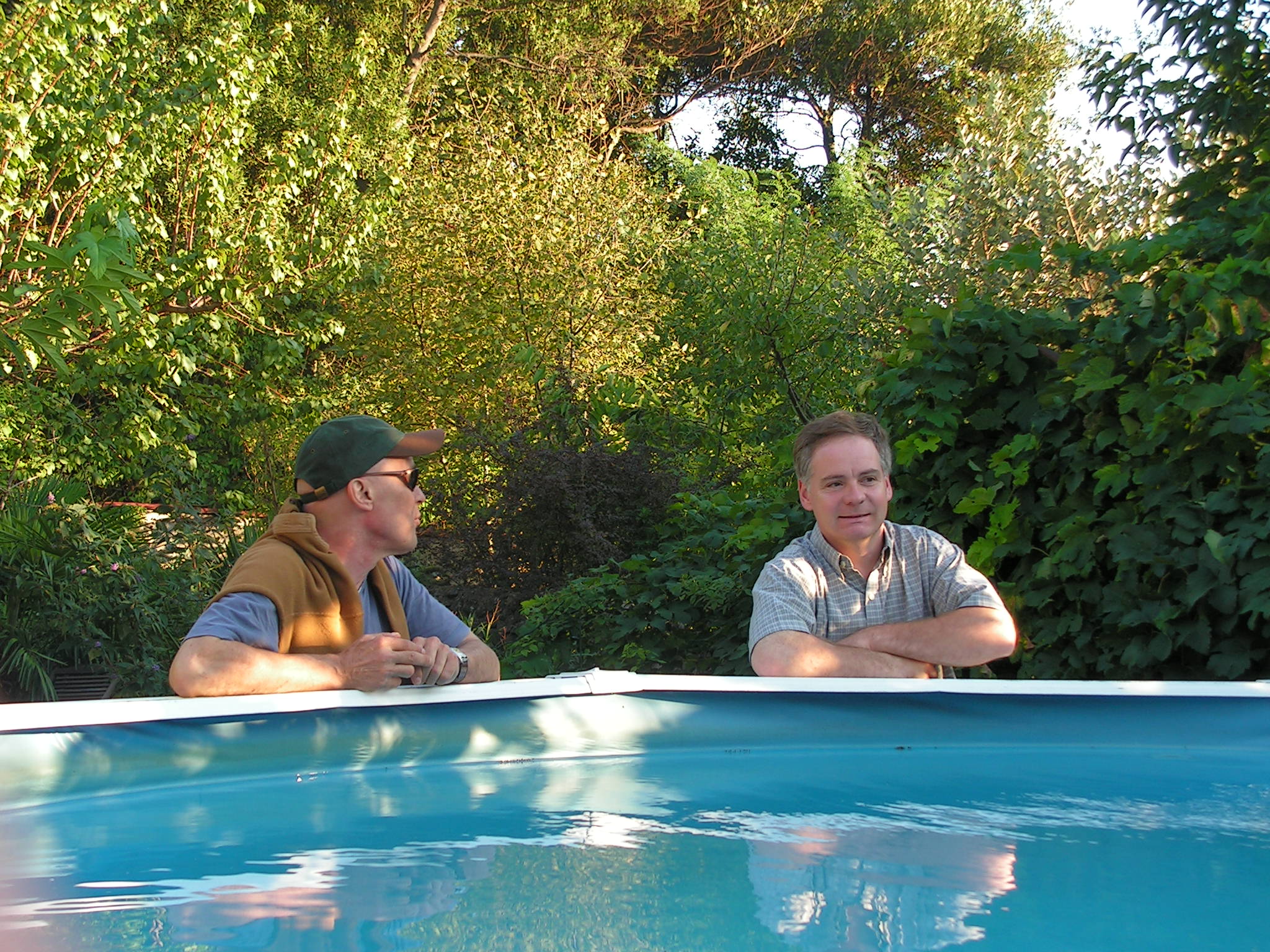 people next to  pool to show proportions