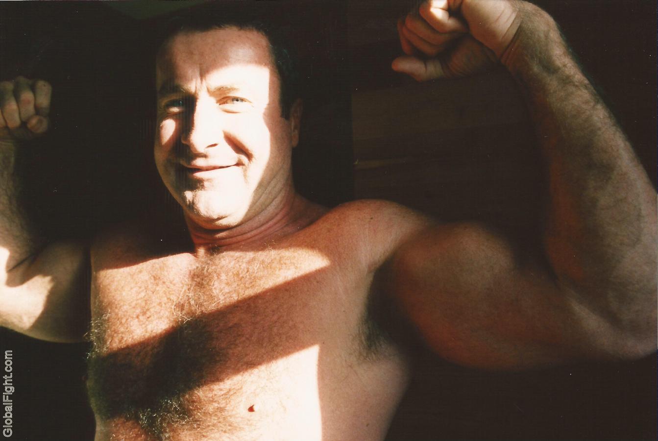 huge hairy powerlifting woodshed daddy flexing muscles.jpg