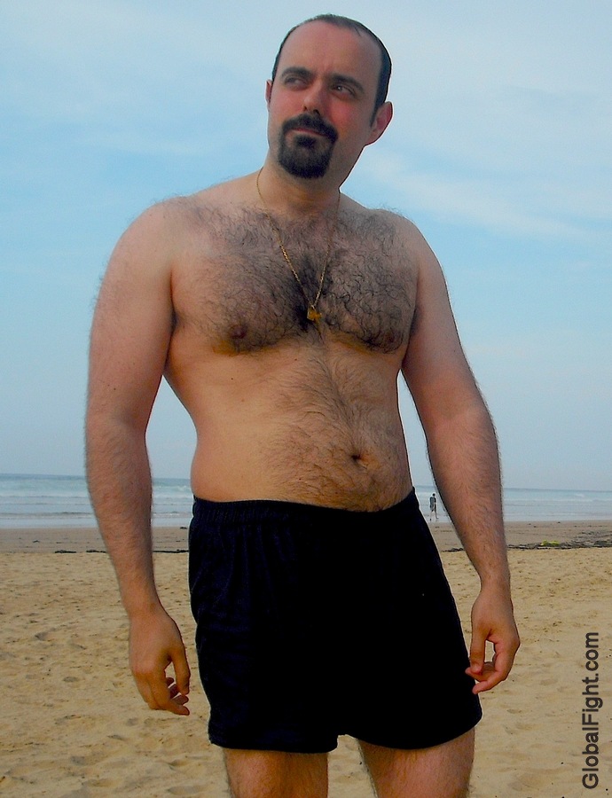 very hairy chest man on beach sandy.jpg