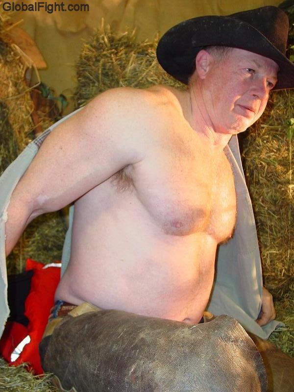 cowboy rancher removing shirtless working barn.jpg