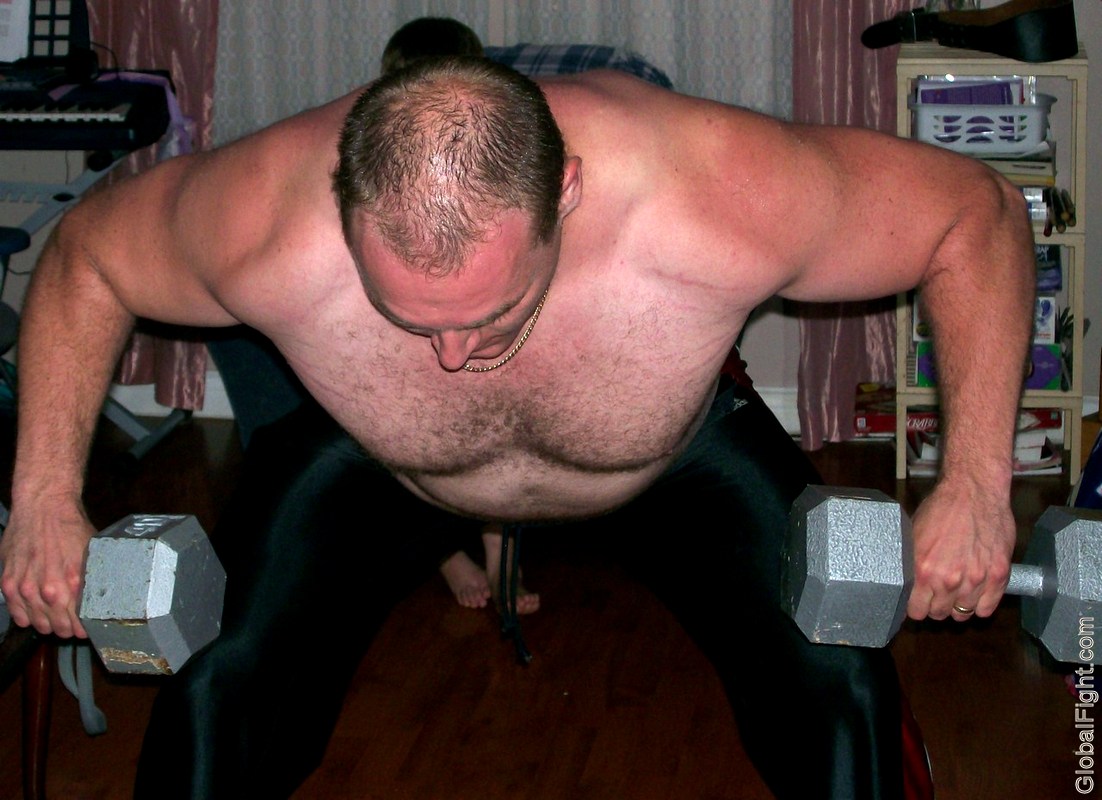 hairy beefy man lifting weights.jpeg