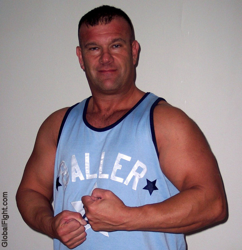 handsome husband flexing big arms hot dads.jpg