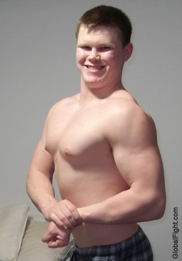 cute handsome young college freshman flexing muscle.jpg