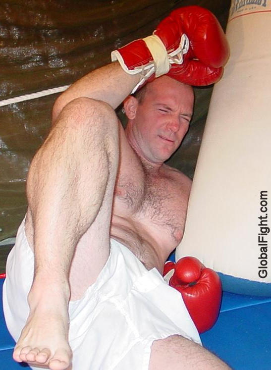 boxer knocked into turnbuckles.jpg