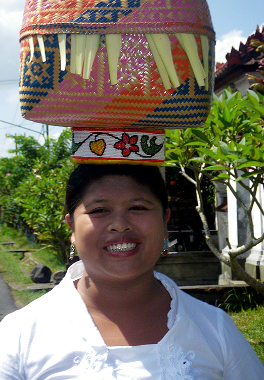 Woman with basket of offerings