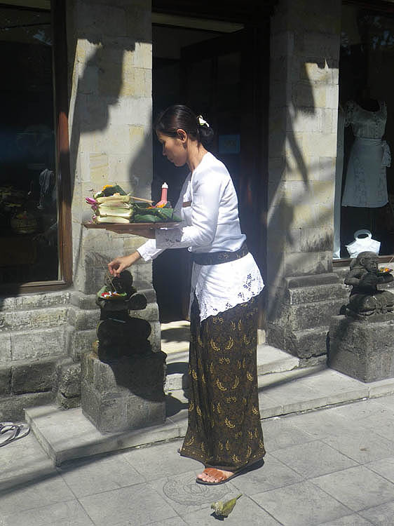 Local woman in street with offerings.  The other side of Kuta.