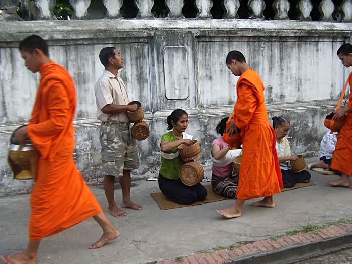 Monks and almsgivers, early morning, Luang Prabang