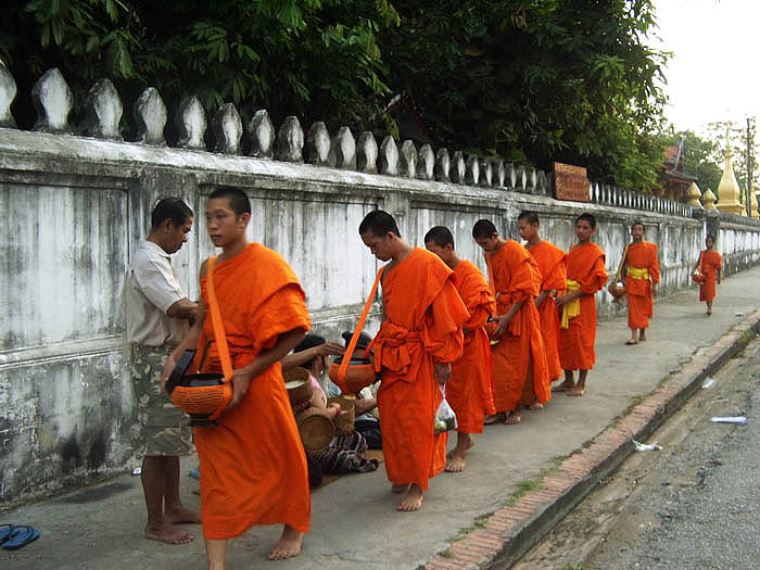 Monks receiving rice in the early morning, Luang Prabang