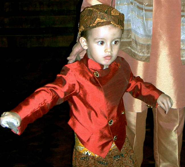 'Mas Lachlan'  dressed for his brother's seventh-month ceremony