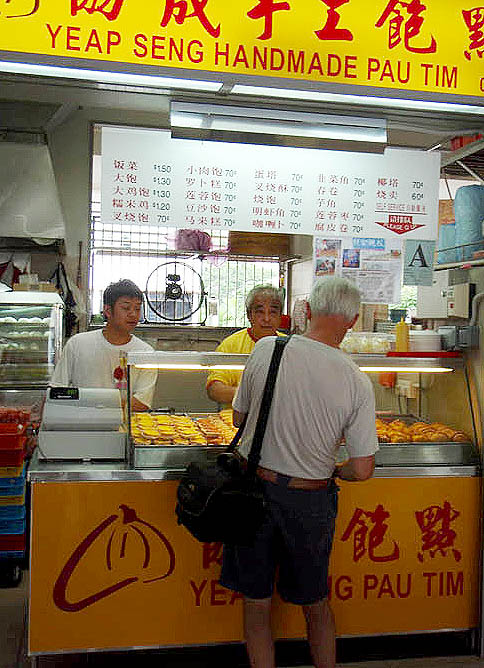 Philip makes a purchase at a food stall, 2008
