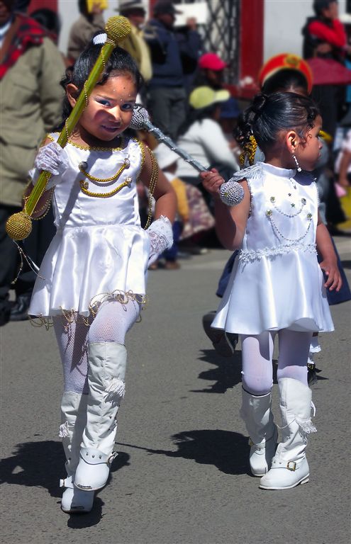 Two Small Dolls Are Leading Parade, Puno