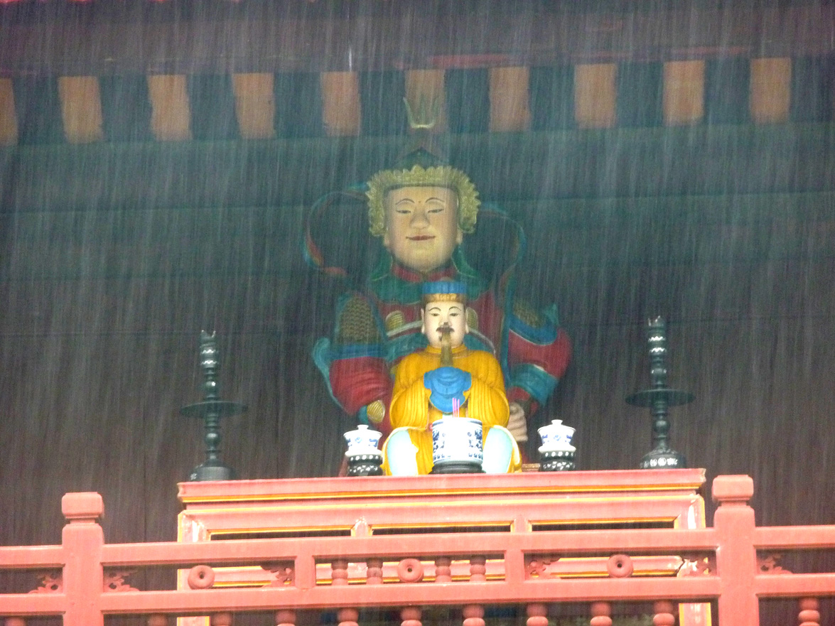 On the top floor of the sanctuary, is this Buddhist statue.  You could see that it was raining hard that day.