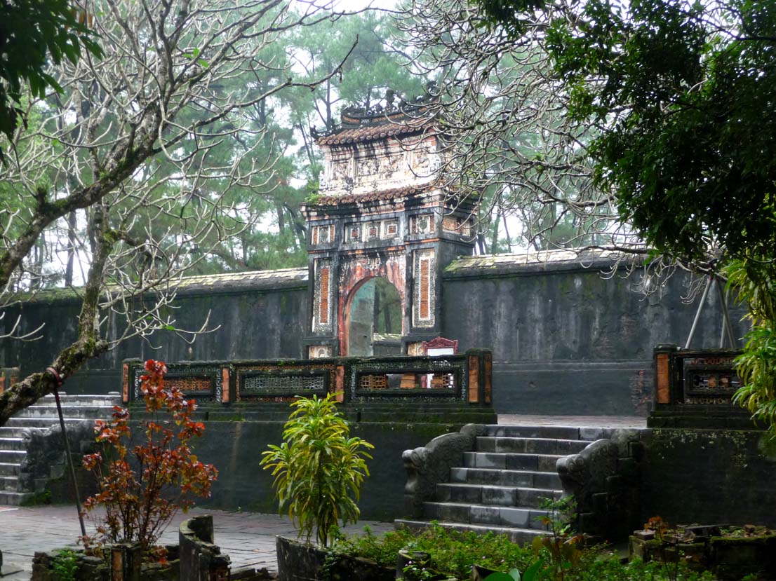A side view of the Stele Pavilion through the trees.