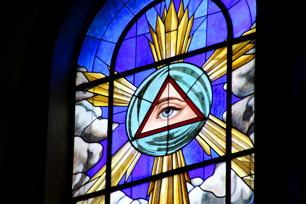This stained glass window represents the Eye of God.