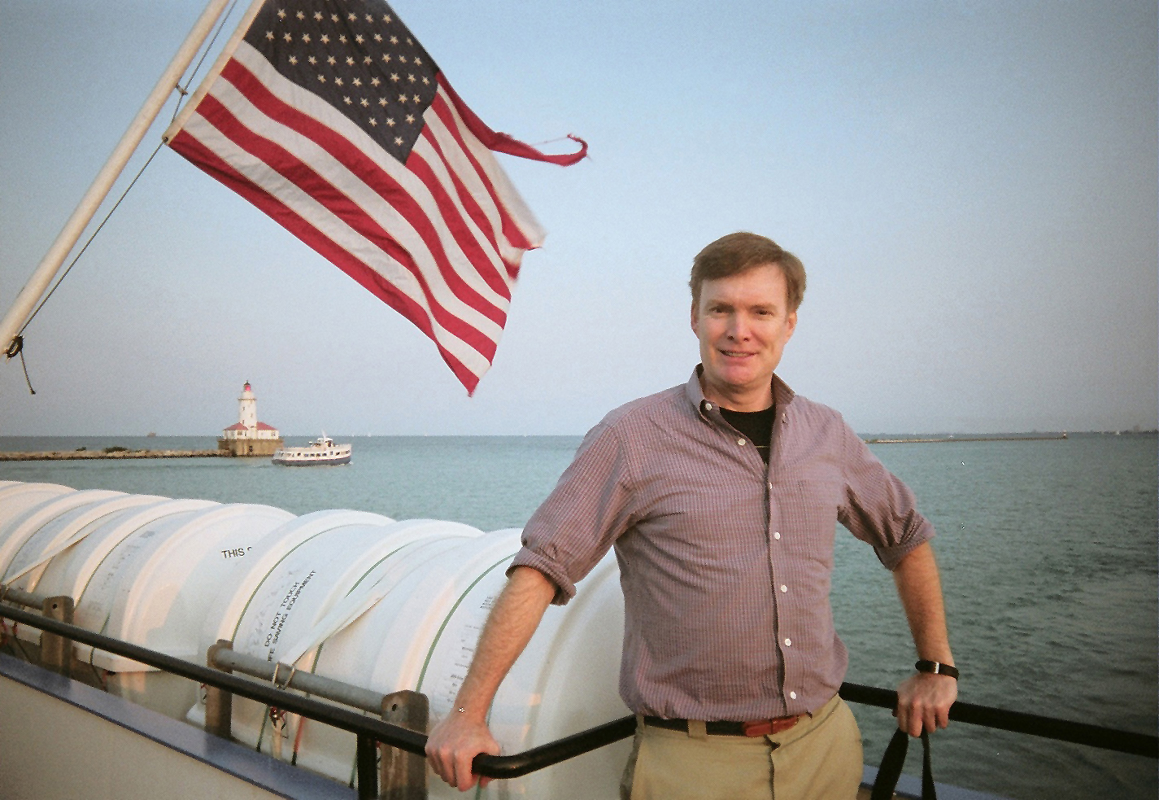 Here I am on the Mystic Blue cruise ship in front of the American flag.