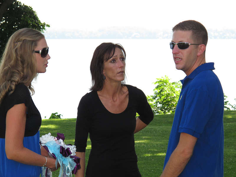 Stacy & Tom talking with the wedding coordinator