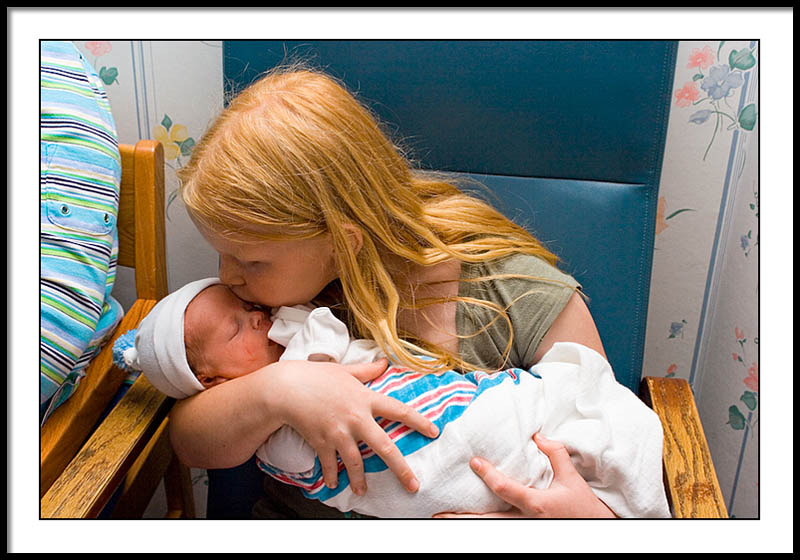 Just a little kiss for the new baby brither..