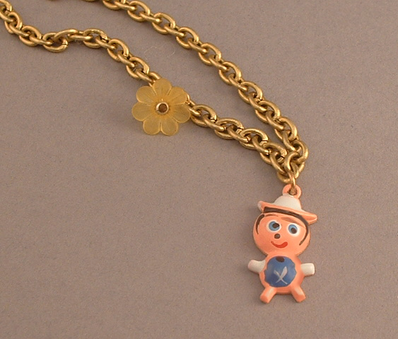 WVB5- Peruvian village boy Bracelet (on brass chain with lucite flower)