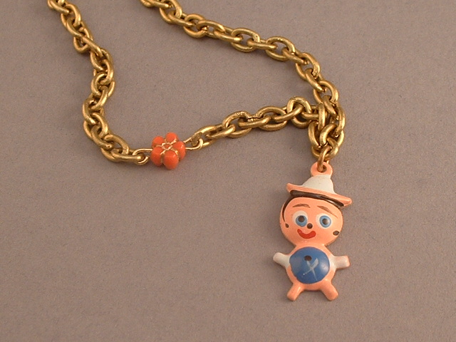 WVB7 - Peruvian village boy Bracelet (on brass chain with cinnabar flower)