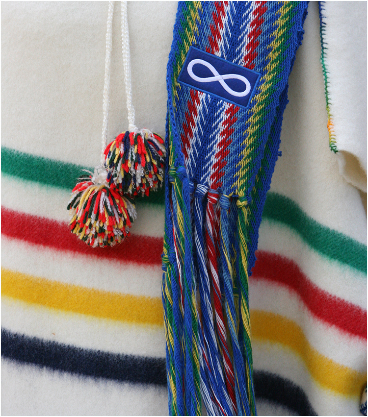 Metis Infinity Symbol and sash on Hudson Bay Blanket Capote