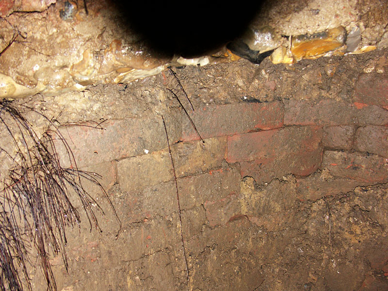 Brickwork at the bottom of the hole