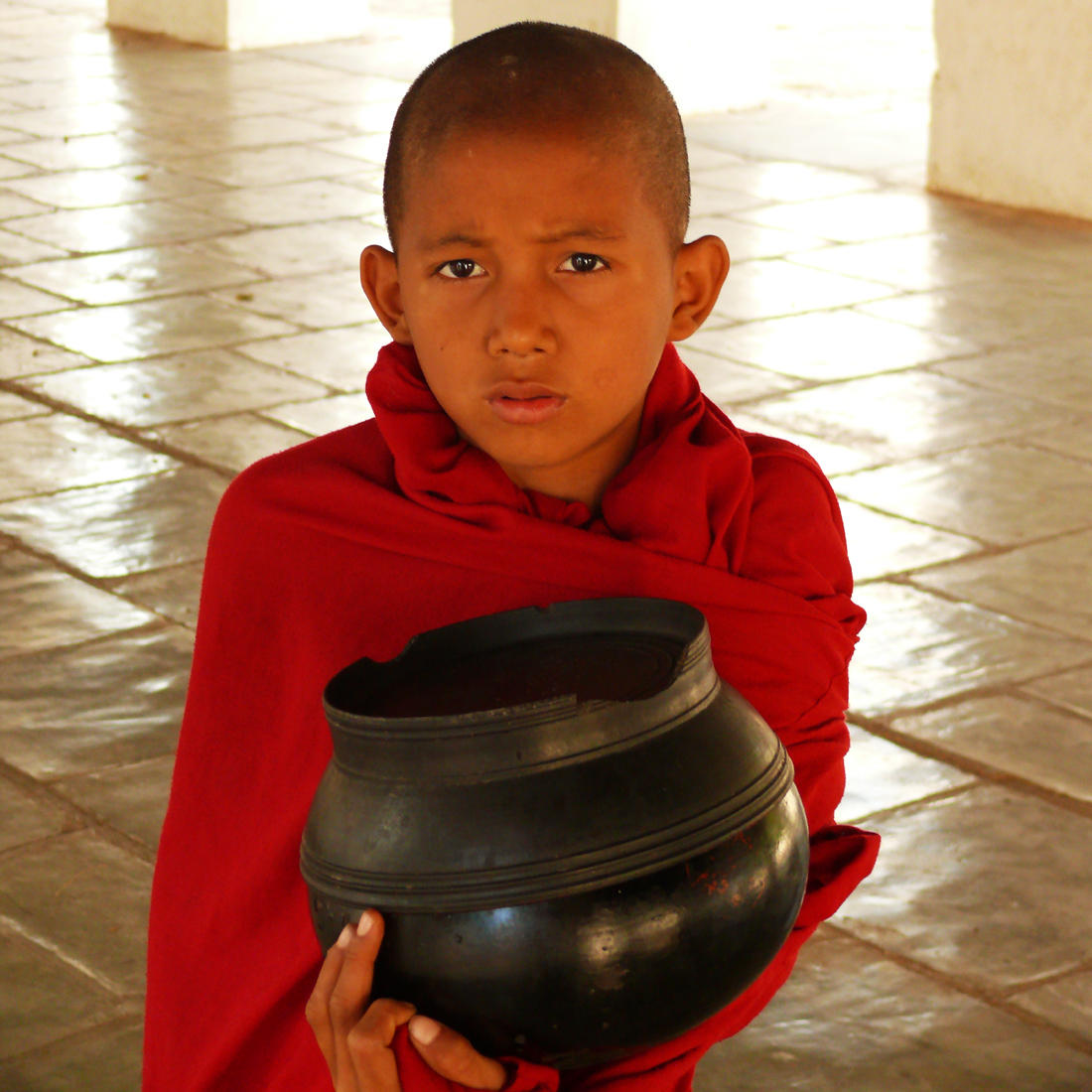 Novice with alms bowl Shwezigon.jpg