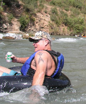 He's not so cool when he hits the rapids, but he saves the beer