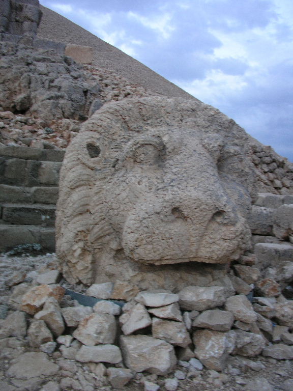Stone lion to the right of the site.