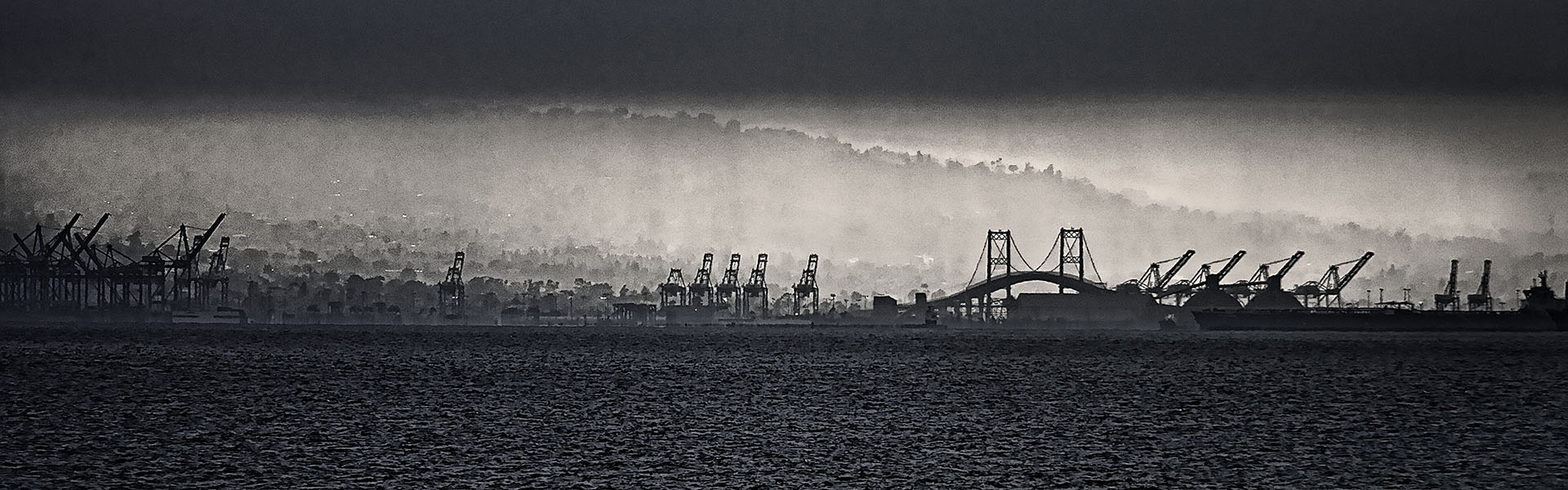 Long Beach harbor under a foggy sunset