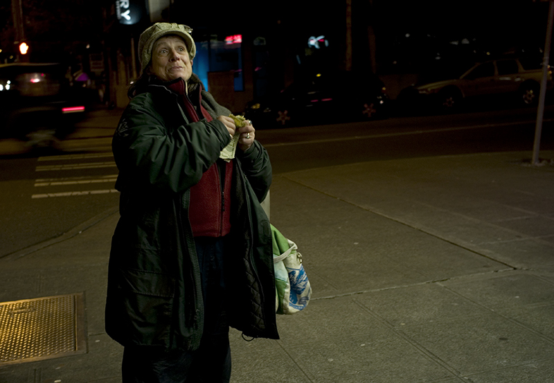 Lady Selling Papers