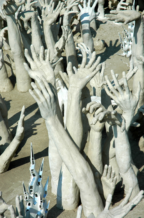 Hands reaching up from hell