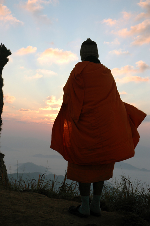 Monk at Phu Chee Fa sunrise