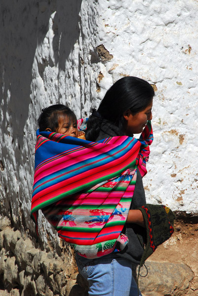 Woman with child in a blanket