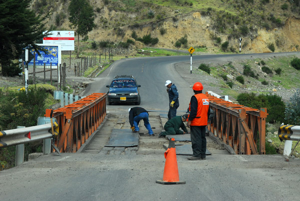 Obstacle - repair crew working on a narrow bridge