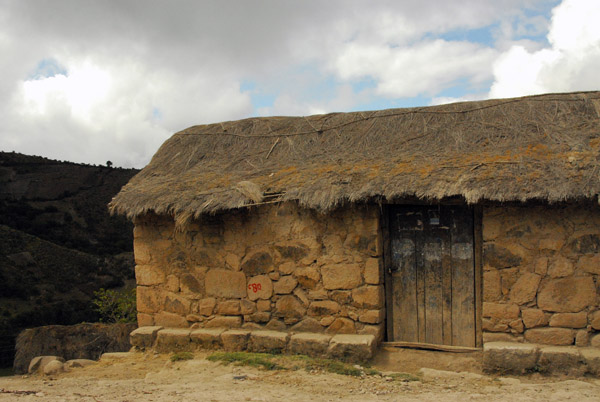 Thatched hut on the side of the road
