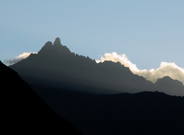 Sun setting behind Andean peak, Sacred Valley
