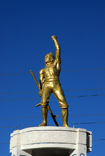 Monument of a muscular figure, El Cholo Juliaca