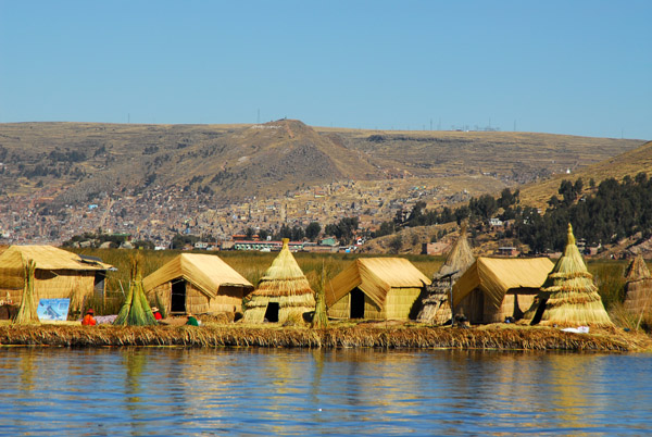 Huts and teepee-like dwellings are built on floating rafts of vegetation
