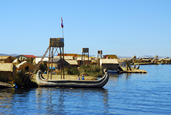 Large reed boat pulled up alongside the floating islands