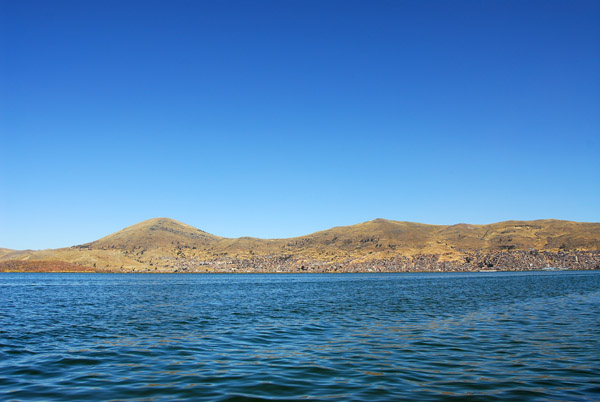 Puno in the distance across Lake Titicaca