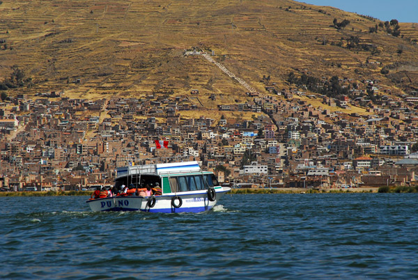 Tourist boat sailing back to Puno