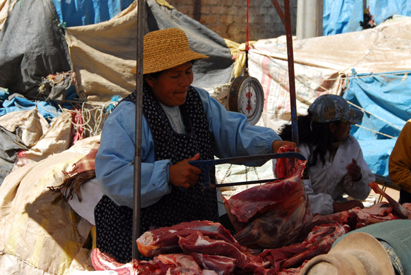 Butcher with a hacksaw, Puno Market