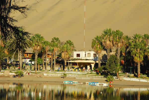 The Laguna of Huacachina is surrounded by hotels, guesthouses, bars and restaurants